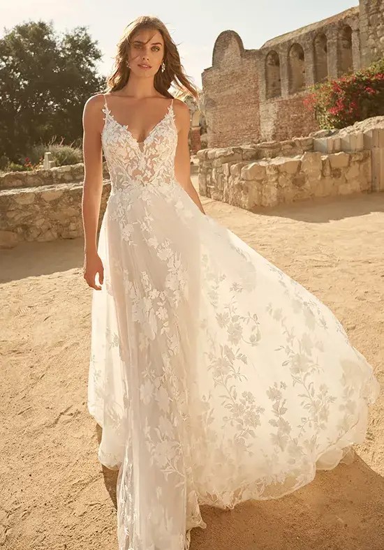 Model wearing a white Maggie Sottero gown