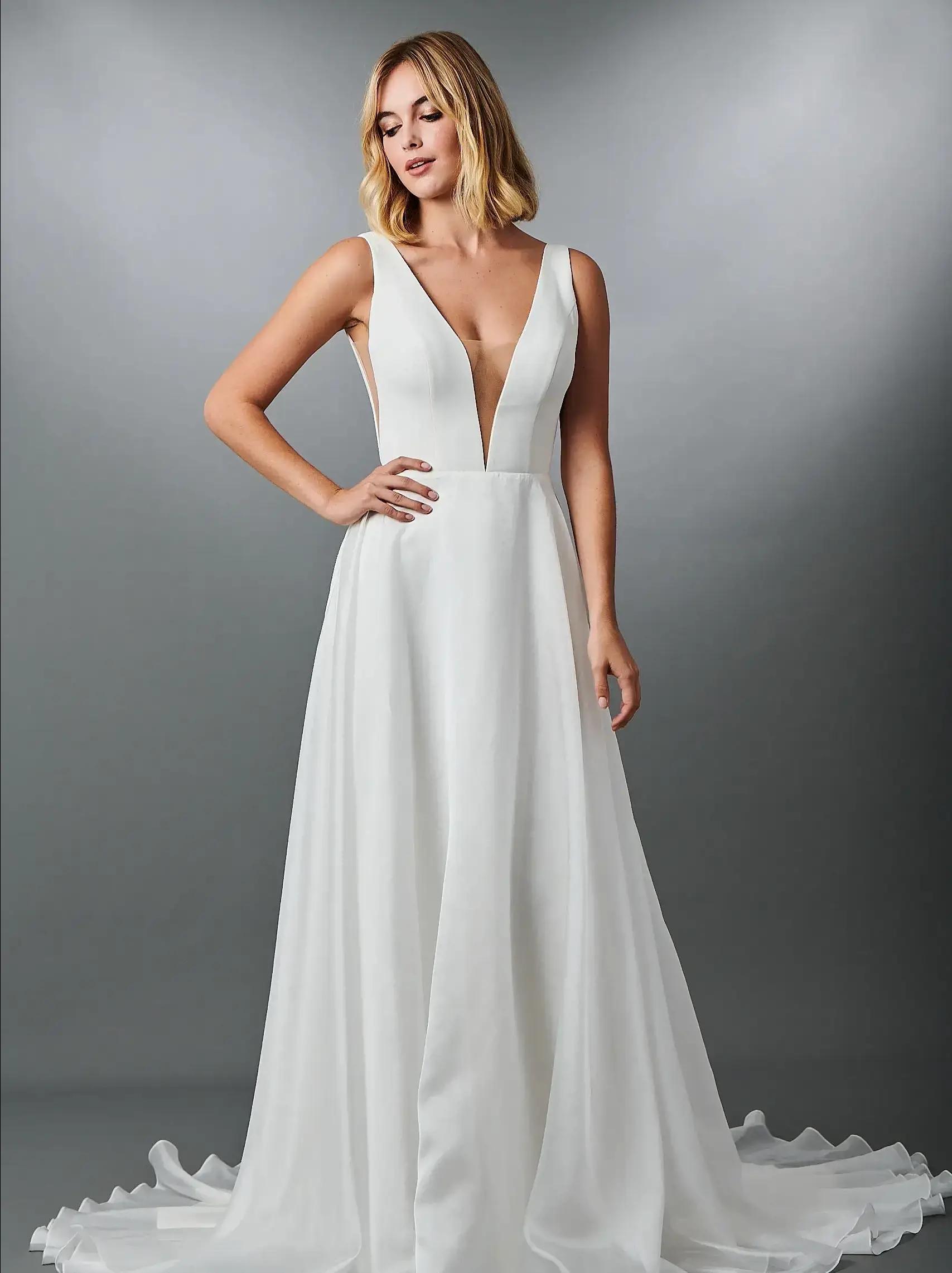 Model wearing a white kelly faetanini gown