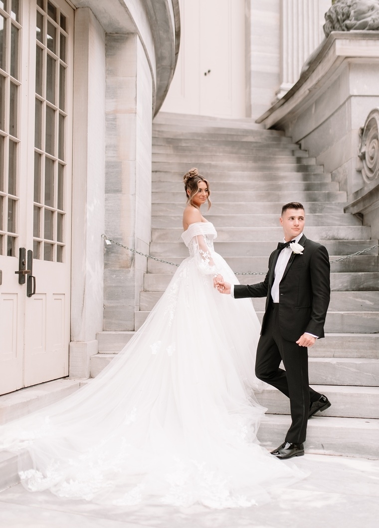 Photo of the real bride and groom near the stairs